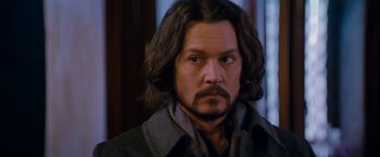 Movie still from “The Tourist” (2010), directed by Florian Henckel von Donnersmarck – A person with long black hair; Close Up shot, Over the shoulder angle