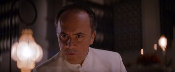 Movie still from “The Tourist” (2010), directed by Florian Henckel von Donnersmarck – A person wearing a white shirt; Close Up shot, Low angle