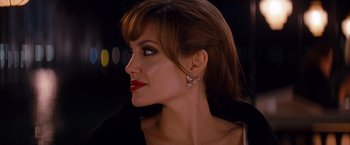 Movie still from “The Tourist” (2010), directed by Florian Henckel von Donnersmarck – A person wearing a dress; Close Up shot, Over the shoulder angle