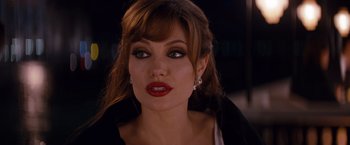 Movie still from “The Tourist” (2010), directed by Florian Henckel von Donnersmarck – A person wearing a black jacket; Close Up shot, Over the shoulder angle