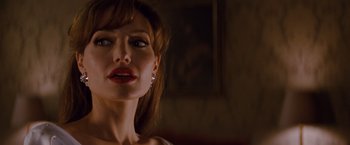 Movie still from “The Tourist” (2010), directed by Florian Henckel von Donnersmarck – A person wearing a white shirt; Close Up shot, Over the shoulder angle