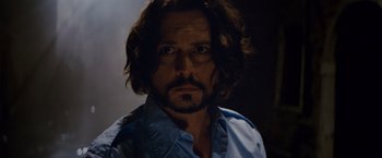 Movie still from “The Tourist” (2010), directed by Florian Henckel von Donnersmarck – A person with long hair; Close Up shot, Low angle