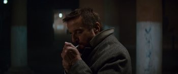 Movie still from “The Tourist” (2010), directed by Florian Henckel von Donnersmarck – A person brushing his teeth; Close Up shot, Low angle