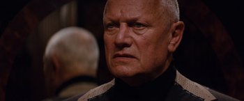 Movie still from “The Tourist” (2010), directed by Florian Henckel von Donnersmarck – An older man is looking into the distance; Close Up shot, Over the shoulder angle