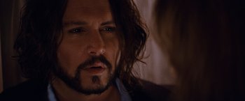 Movie still from “The Tourist” (2010), directed by Florian Henckel von Donnersmarck – A person with long hair; Close Up shot, Over the shoulder angle