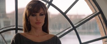 Movie still from “The Tourist” (2010), directed by Florian Henckel von Donnersmarck – A person wearing a sweater; Close Up shot, Over the shoulder angle