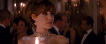 Movie still from “The Tourist” (2010), directed by Florian Henckel von Donnersmarck – A person wearing a necklace; Close Up shot, Over the shoulder angle