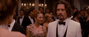 Movie still from “The Tourist” (2010), directed by Florian Henckel von Donnersmarck – A man and a woman in formal wear at an event; Close Up shot, Over the shoulder angle