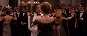 Movie still from “The Tourist” (2010), directed by Florian Henckel von Donnersmarck – A man and a woman dancing in formal wear; Medium shot, Over the shoulder angle