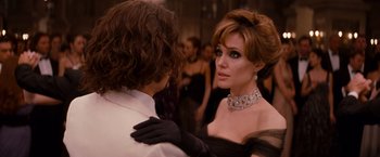 Movie still from “The Tourist” (2010), directed by Florian Henckel von Donnersmarck – A man and a woman in formal wear at an event; Close Up shot, Over the shoulder angle