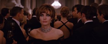 Movie still from “The Tourist” (2010), directed by Florian Henckel von Donnersmarck – A person wearing a dress; Close Up shot, Over the shoulder angle