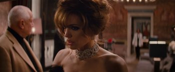 Movie still from “The Tourist” (2010), directed by Florian Henckel von Donnersmarck – A woman wearing a necklace with a diamond necklace; Close Up shot, Over the shoulder angle