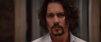 Movie still from “The Tourist” (2010), directed by Florian Henckel von Donnersmarck – A person with long hair; Close Up shot, Over the shoulder angle