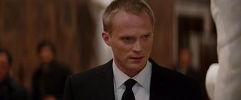 Movie still from “The Tourist” (2010), directed by Florian Henckel von Donnersmarck – A person wearing a suit and tie; Close Up shot, Over the shoulder angle