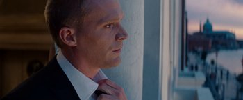Movie still from “The Tourist” (2010), directed by Florian Henckel von Donnersmarck – A person wearing a suit and tie; Close Up shot, Low angle