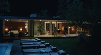Movie still from “Euphoria” (2019), created by Sam Levinson – A couple of people standing in front of a house; Extreme Wide shot, High angle