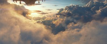 Movie still from “Ender's Game” (2013), directed by Gavin Hood – A view of the sky from a plane window at sunset; Extreme Wide shot, Low angle
