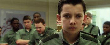 Movie still from “Ender's Game” (2013), directed by Gavin Hood – A group of young men standing next to each other in a room; Close Up shot, Low angle
