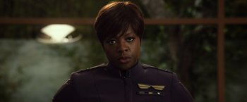 Movie still from “Ender's Game” (2013), directed by Gavin Hood – A woman in a purple uniform looking at the camera; Close Up shot, Over the shoulder angle