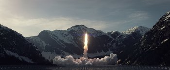 Movie still from “Ender's Game” (2013), directed by Gavin Hood – A rocket launching into the sky with a mountain in the background; Extreme Wide shot, Low angle