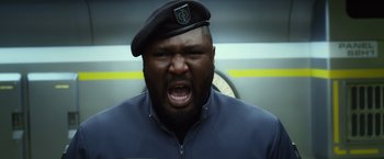 Movie still from “Ender's Game” (2013), directed by Gavin Hood – A man in a military uniform is yelling at the camera; Close Up shot, Low angle