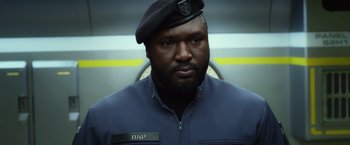 Movie still from “Ender's Game” (2013), directed by Gavin Hood – A man wearing a uniform and a hat; Close Up shot, Low angle