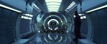 Movie still from “Ender's Game” (2013), directed by Gavin Hood – A group of people sitting in a room with lights on the ceiling; Wide shot, Low angle