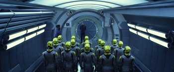 Movie still from “Ender's Game” (2013), directed by Gavin Hood – A group of people in grey and yellow suits; Wide shot, Overhead angle