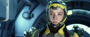 Movie still from “Ender's Game” (2013), directed by Gavin Hood – A person wearing a helmet in a space suit; Close Up shot, Low angle