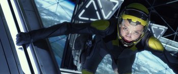 Movie still from “Ender's Game” (2013), directed by Gavin Hood – A man in a space suit is flying in the air; Medium shot, Low angle