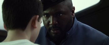 Movie still from “Ender's Game” (2013), directed by Gavin Hood – A person looking at another person; Close Up shot, Over the shoulder angle