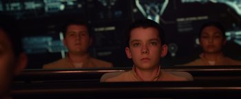 Movie still from “Ender's Game” (2013), directed by Gavin Hood – A young man sitting in a car looking into a mirror; Close Up shot, Over the shoulder angle