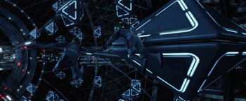 Movie still from “Ender's Game” (2013), directed by Gavin Hood – A man in a space suit flying through the air; Wide shot, Overhead angle