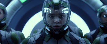 Movie still from “Ender's Game” (2013), directed by Gavin Hood – A person wearing a helmet in a room; Close Up shot, Low angle