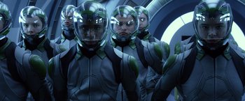 Movie still from “Ender's Game” (2013), directed by Gavin Hood – A group of people in a room with helmets on; Medium shot, Low angle