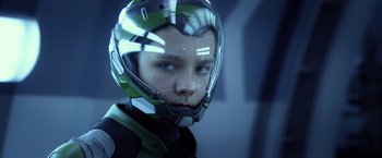 Movie still from “Ender's Game” (2013), directed by Gavin Hood – A young boy wearing a futuristic helmet in the dark; Close Up shot, Low angle