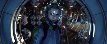 Movie still from “Ender's Game” (2013), directed by Gavin Hood – A man wearing a helmet in front of a wall of lights; Close Up shot, Over the shoulder angle