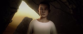 Movie still from “Ender's Game” (2013), directed by Gavin Hood – A young boy is standing in a cave looking up; Close Up shot, High angle