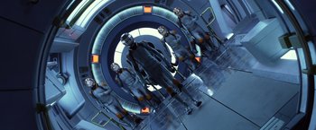 Movie still from “Ender's Game” (2013), directed by Gavin Hood – A group of people standing in a room; Wide shot, Low angle