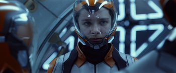 Movie still from “Ender's Game” (2013), directed by Gavin Hood – A person wearing a helmet in a space suit; Close Up shot, Low angle