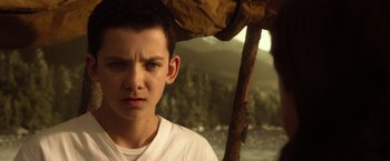 Movie still from “Ender's Game” (2013), directed by Gavin Hood – A young boy is looking into the camera; Close Up shot, Over the shoulder angle