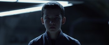 Movie still from “Ender's Game” (2013), directed by Gavin Hood – A young boy is looking into the camera; Close Up shot, Low angle
