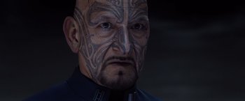 Movie still from “Ender's Game” (2013), directed by Gavin Hood – A person with a tattoo on his face; Close Up shot, Over the shoulder angle