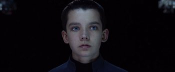Movie still from “Ender's Game” (2013), directed by Gavin Hood – A young boy with blue eyes stares into the camera; Close Up shot, High angle