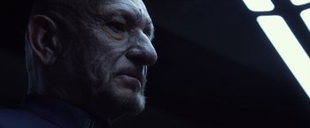 Movie still from “Ender's Game” (2013), directed by Gavin Hood – An old man with a long beard looking to his left; Close Up shot, Low angle