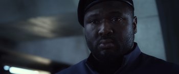 Movie still from “Ender's Game” (2013), directed by Gavin Hood – A person wearing a hat; Close Up shot, Low angle