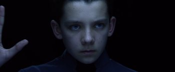 Movie still from “Ender's Game” (2013), directed by Gavin Hood – A young boy with blue eyes stares into the camera; Close Up shot, High angle