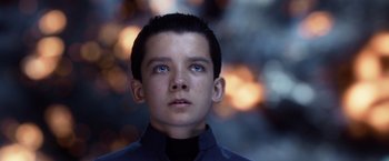 Movie still from “Ender's Game” (2013), directed by Gavin Hood – A young boy with blue eyes stares into the distance; Close Up shot, Overhead angle