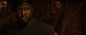 Movie still from “Ender's Game” (2013), directed by Gavin Hood – A person wearing a uniform; Close Up shot, Low angle