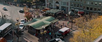 Movie still from “The Town” (2010), directed by Ben Affleck – An aerial view of a bus stop in a city; Extreme Wide shot, High angle